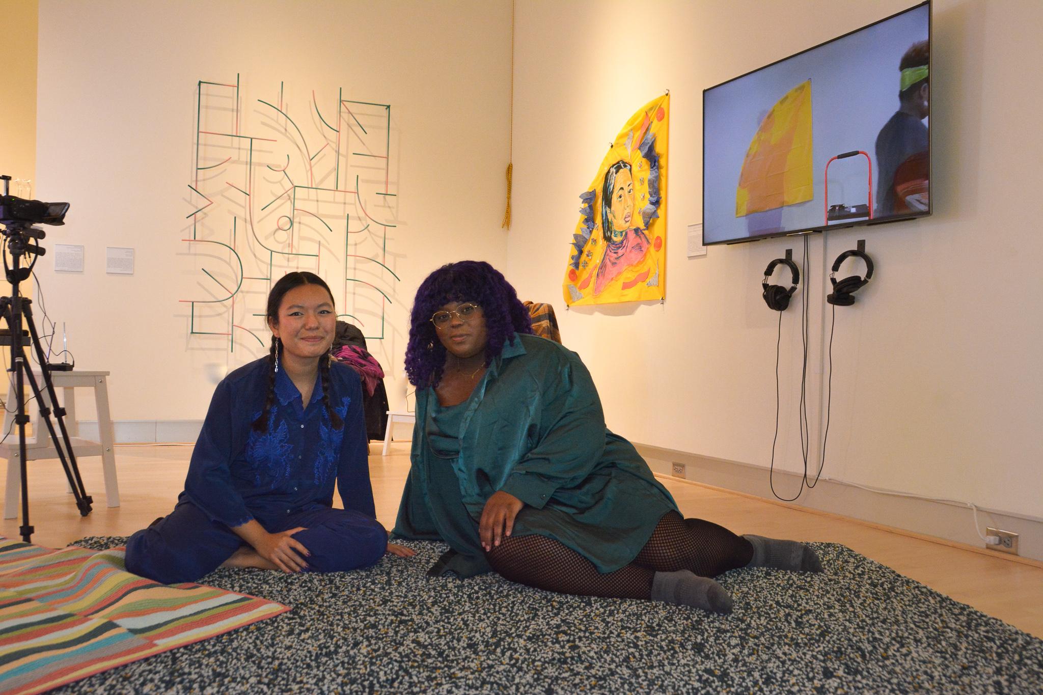 Artists Chanel Thervil and Mel Taing in the University Hall Gallery.  