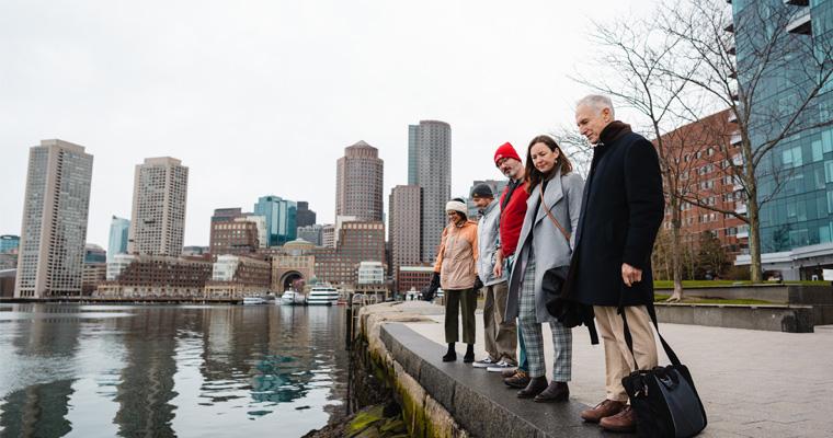 Paul Kirshen and associates look out on the Boston Harbor 