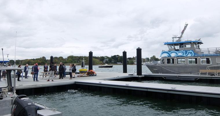 Event attendees gather at Fox Point on the UMass Boston campus. 