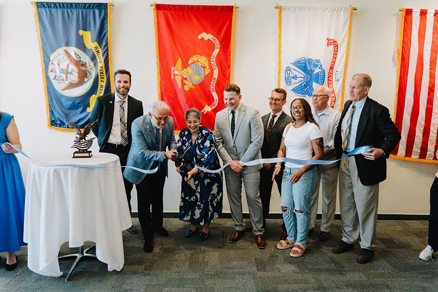 Campus leaders and students cut the ribbon on a new Student Veteran Center.