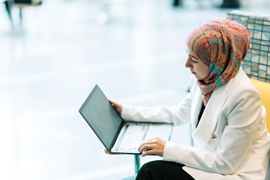 Management student using a laptop